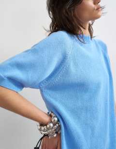 Model wearing Knitted half sleeve t-shirt in cornflower blue