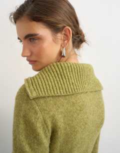 Model wearing Knitted half zip funnel neck jumper with wool in green