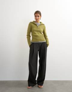 Model wearing Knitted half zip funnel neck jumper with wool in green