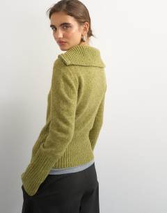 Model wearing Knitted half zip funnel neck jumper with wool in green