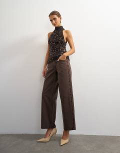 Model wearing Knitted halter neck sequin top in chocolate brown