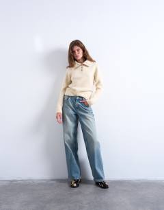 Model wearing Knitted heavy compact polo jumper in ecru