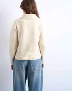 Model wearing Knitted heavy compact polo jumper in ecru