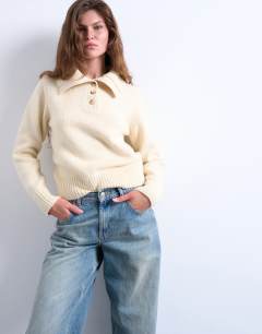 Model wearing Knitted heavy compact polo jumper in ecru