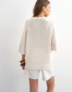 Model wearing Knitted henley t-shirt in ivory