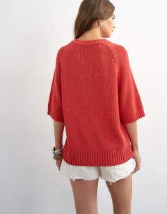 Model wearing Knitted henley t-shirt in red