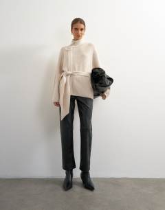 Model wearing Knitted high funnel neck utility jacket with wool in beige