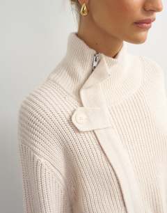 Model wearing Knitted high funnel neck utility jacket with wool in beige