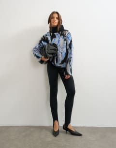 Model wearing Knitted high neck floral brushed jumper in multi