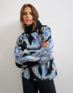 Model wearing Knitted high neck floral brushed jumper in multi