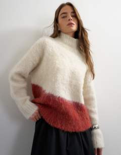 Model wearing Knitted high neck hairy oversized abstract print jumper in neutral