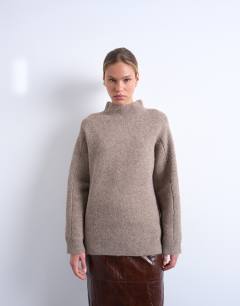Model wearing Knitted high neck jumper in espresso