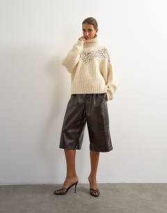 Model wearing Knitted high neck ribbed jumper lace detail in ivory