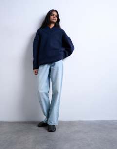 Model wearing Knitted High V-Neck Oversized Longline Jumper in Navy