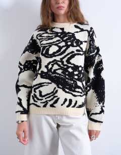 Model wearing Knitted jacquard clean abstract  floral jumper in mono