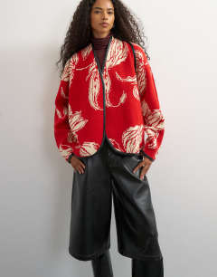 Model wearing Knitted kimono PU trim jacket in red and ivory