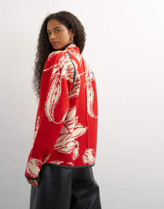 Model wearing Knitted kimono PU trim jacket in red and ivory