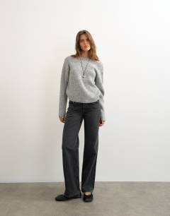Model wearing Knitted knot back detail jumper with wool in light grey