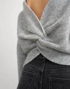 Model wearing Knitted knot back detail jumper with wool in light grey