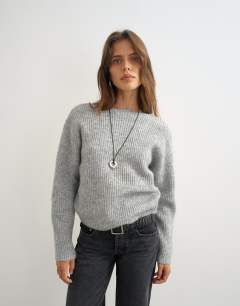 Model wearing Knitted knot back detail jumper with wool in light grey