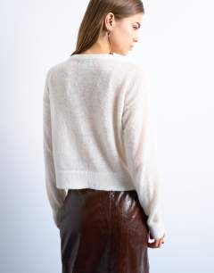 Model wearing Knitted lightweight crew cardigan in oat