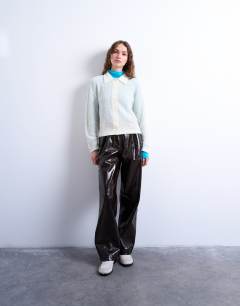 Model wearing Knitted lofty collared cardigan in ecru