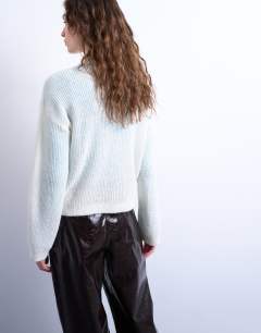 Model wearing Knitted lofty collared cardigan in ecru