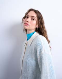 Model wearing Knitted lofty collared cardigan in ecru
