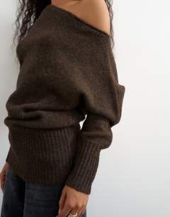 Model wearing Knitted long sleeve fallen shoulder jumper with wool in tobacco