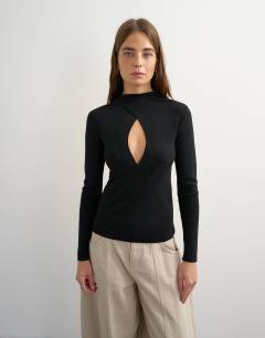 Model wearing Knitted long sleeve front drape keyhole top in black