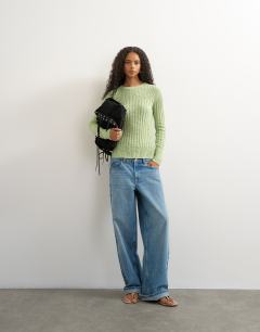Model wearing Knitted long sleeve slim fit crew neck ribbed top in pistachio