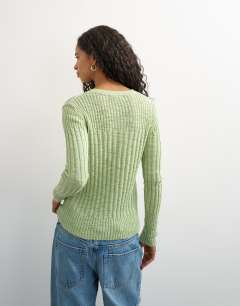 Model wearing Knitted long sleeve slim fit crew neck ribbed top in pistachio
