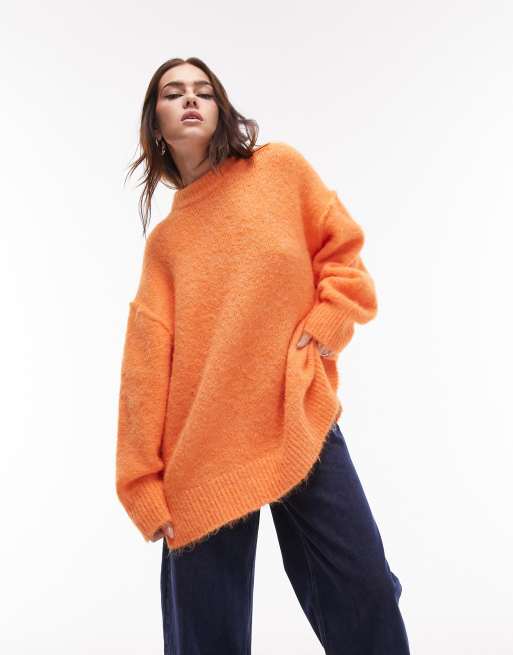 Topshop knitted longline exposed seam fluffy crew neck jumper in orange