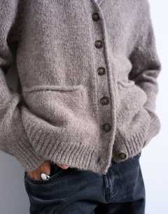 Model wearing Knitted longline pocket chunky wool mix cardigan