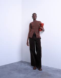 Model wearing Knitted longline waistcoat in chocolate