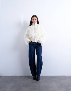 Model wearing Knitted loop funnel zip through in ivory