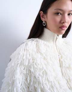 Model wearing Knitted loop funnel zip through in ivory