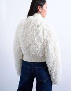 Model wearing Knitted loop funnel zip through in ivory