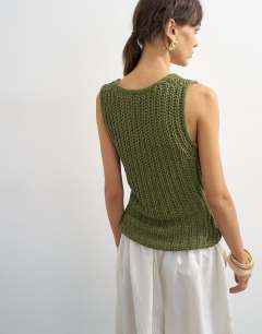 Model wearing Knitted low scoop crochet vest top in khaki