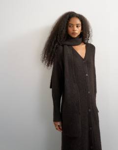 Model wearing Knitted maxi cardigan with button detail in tobacco