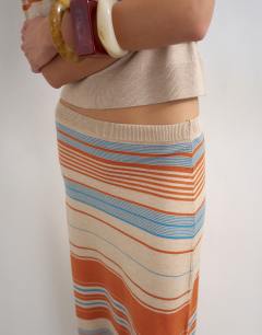 Model wearing Knitted maxi stripe skirt co-ord in blue multi