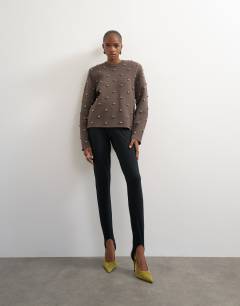 Model wearing Knitted metal studded shoulder pad jumper in brown