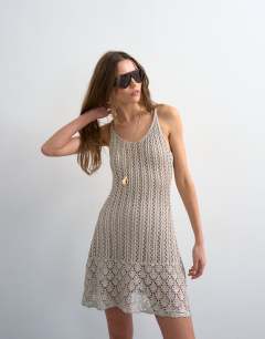 Model wearing Knitted metallic premium crochet mini dress in gold