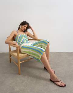 Model wearing Knitted mix stripe co-ord longline jort in green and blue multi