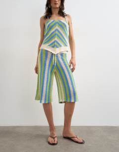 Model wearing Knitted mix stripe co-ord longline jort in green and blue multi
