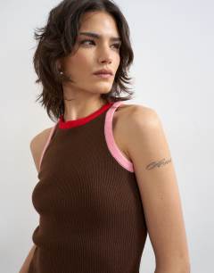 Model wearing Knitted multi colour trim racer vest in brown
