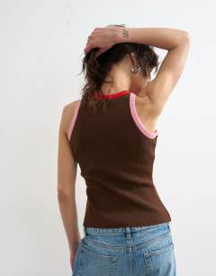 Model wearing Knitted multi colour trim racer vest in brown