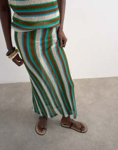 Model wearing Knitted multi stripe co-ord maxi skirt in blue and brown