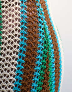 Model wearing Knitted multi stripe co-ord maxi skirt in blue and brown