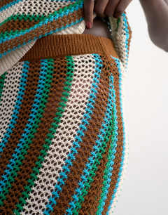 Model wearing Knitted multi stripe co-ord maxi skirt in blue and brown